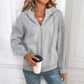 Detail of silver rhinestones and metal beads on a light grey hooded zip-up sweatshirt - S / Light Gray