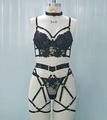 Detail of black lace lingerie set featuring intricate embroidery and multi-strap design - S / Black