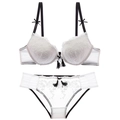 Elegant white lace lingerie set with black bow accents and tassels on a clean white background - 70C / White