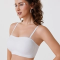 White seamless bra with adjustable thin straps and wide supportive band on model - S / White