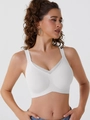 Seamless white V-neck sports bra with sheer mesh panels and supportive wide straps - White
