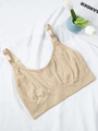 Close-up of beige nursing bra with jacquard texture and nursing clip for breastfeeding - 1XL / Nude