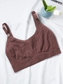 Detailed macro view of spiral textured fabric and nursing buckle on brown maternity bra - 1XL / Burgundy