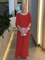 Detail of red chiffon top with sequined neckline and cape sleeves and wide-leg trousers - Red