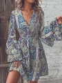Detail of bohemian paisley V-neck dress featuring layered bell sleeves and floral prints - S / Teal
