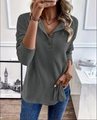 Detail of dark grey ribbed knit hoodie with three decorative buttons on the V-neckline - S / Tops / Gray