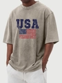 Détail d'un t-shirt vintage gris-vert avec imprimé du drapeau américain usé - S / Hauts / Kaki