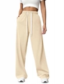 Detail of high waisted wide leg joggers featuring elastic waistband and drawstring - Apricot