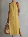 Detail of a yellow halter maxi dress featuring lace embroidery and side slit detail - S / Yellow