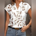 White V-neck short sleeve t-shirt for women featuring an artistic brown leaf print pattern - S / White