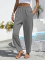 Close-up of high-waist elastic waistband and deep pockets on grey linen pants - S / Gray