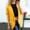 Detail eines hellgelben langen Blazers mit Reverskragen und praktischen Seitentaschen - S / Gelb
