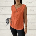Detail view of orange cotton linen sleeveless shirt with V-neckline and button feature - Orange