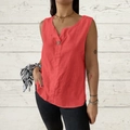 Detail of coral red cotton linen top showing V-neck and large button texture - Red