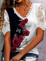 Detail of V-neck lace trim and floral rose print on a short-sleeve contrast T-shirt - S / Black and White Contrast Print