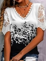 Detailed view of the V-neck lace patchwork and abstract black floral print on white top - White Black Abstract Print