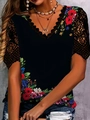 Close-up of floral print top with intricate black eyelash lace trim and V-neckline detail - Black Multi Floral Print