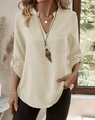 Close-up of the beige buttoned V-neck shirt with breathable cotton linen texture detail - Off White
