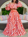 Elegant two-piece off-shoulder top and maxi skirt set with orange geometric print - Red