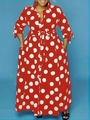 Detail of red long-sleeved dress with white polka dots featuring shirt collar and belt - Red