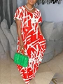 Close-up of red and white abstract graffiti print on a short-sleeved maxi dress - Red