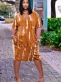 Detail of the V-neckline and orange tie-dye pattern on a loose plus size dress - Orange