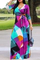 Detailed view of the deep V-neckline and colorful geometric print on the maxi dress - Purple