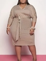 Detailed view of the V-neck polka dot plus size dress with matching waist tie - Apricot
