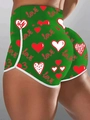 Detail der grünen Shorts mit hoher Taille, rotem Herzprint und weißem Kontrastsau - 3XL / Grün