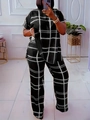 Detail view of women's two-piece set featuring black and white large grid print design - Black