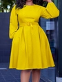 Detail of elegant yellow long-sleeved dress with waist belt and pleated skirt design - Yellow