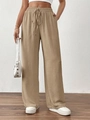 Detail van kaki broek met wijde pijpen, elastische taille met trekkoord en textuurstof - S / Bottoms / Khaki