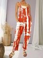Detail of tie-dye printed jumpsuit showing side pockets and relaxed fit design - 1XL / Red