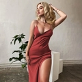 Detail of elegant dark red satin V-neck dress featuring high side slit and sleek fabric - S / Burgundy