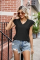 Detail of black V-neck top featuring delicate lace trim and ruffle short sleeves in sunlight - S / Tops / Black