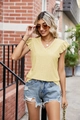 Close-up of bright yellow V-neck top with eyelet embroidery and ruffle sleeve details - S / Tops / Yellow