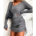 Detail view of the ribbed knit texture and adjustable drawstring hem on this grey V-neck dress - Gray