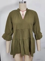 Detail of olive green tiered babydoll top featuring textured fabric and V-neckline - S / Army Green