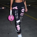 Detail of high waist joggers featuring pink pistol graphics and street style prints - S / Black 2 (Pink Gun Print)