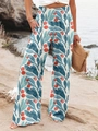 Détail d'un pantalon large à taille haute avec imprimé floral et taille élastique froncée - Vert Marin