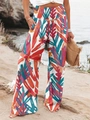Détail de la taille haute élastiquée sur le pantalon large à imprimé tropical - Rouge Orangé