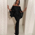 Sparkly black off-shoulder evening gown with ruffles and a slim fit bodycon silhouette - Black