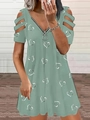 Detail of cold shoulder V-neckline with zipper and white heart print on green dress - Green