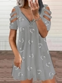 Detail of grey V-neck dress with zipper and heart print showing shoulder cut-out design - Gray