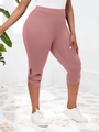 Détail du motif floral ajouré au bas du legging court sport de couleur vieux rose - Rose