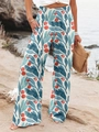 High-waisted wide leg pants with tropical leaf print and elastic smocked waist - Sea Green