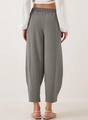 Rear view of grey high-waisted wide leg pants featuring vertical seam and elastic waistband - Gray