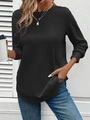 Detail van zwarte wafelgebreide sweater met lange mouwen en een ronde zoomlijn - S / Zwart