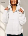 Detail of white quilted anorak showing high neck hood and metal snap button closure - White