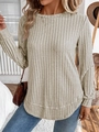 Detail of light beige rib-knit sweater featuring a classic crew neck and drop shoulder design - S / Apricot
